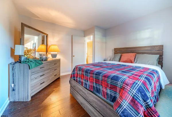 a bedroom with a bed and a dresser