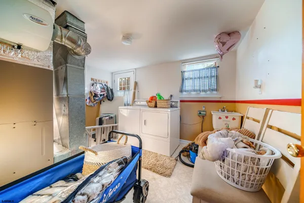 a bedroom with furniture and a wooden floor
