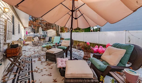 a view of an outdoor sitting area with furniture