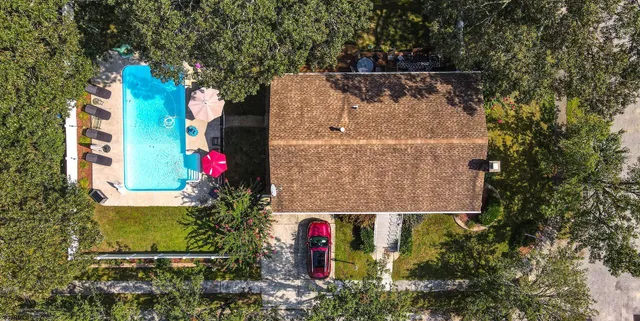 an aerial view of house with yard
