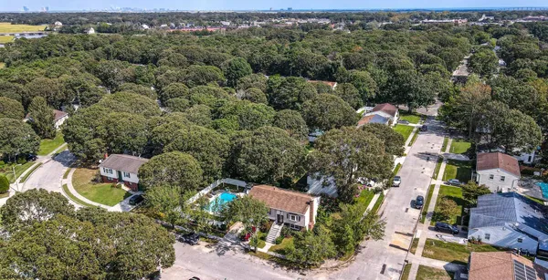 an aerial view of ocean and residential houses