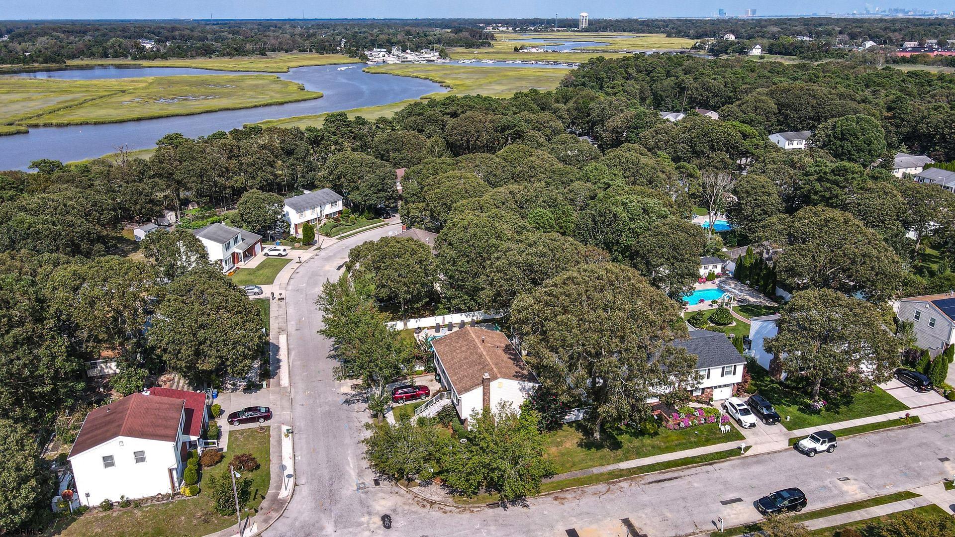 68 Defeo Lane Somers Point, NJ 08244 - Photo 39 of 51 an aerial view of a city with lots of residential buildings ocean and mountain view in back