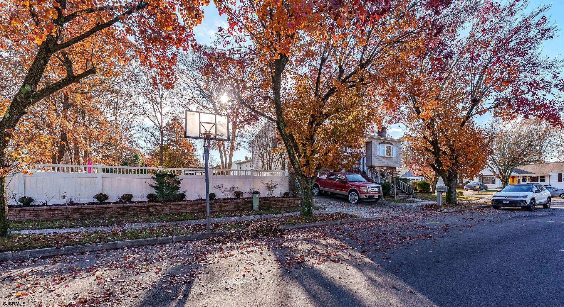 68 Defeo Lane Somers Point, NJ 08244 - Photo 4 of 51 a view of a parked cars in front of a road