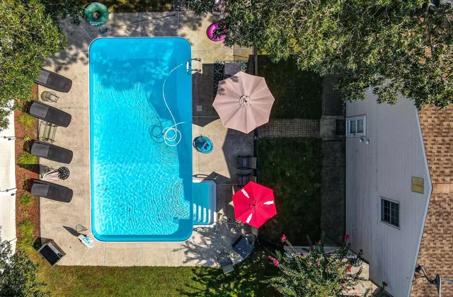 a backyard of a house with yard and outdoor seating