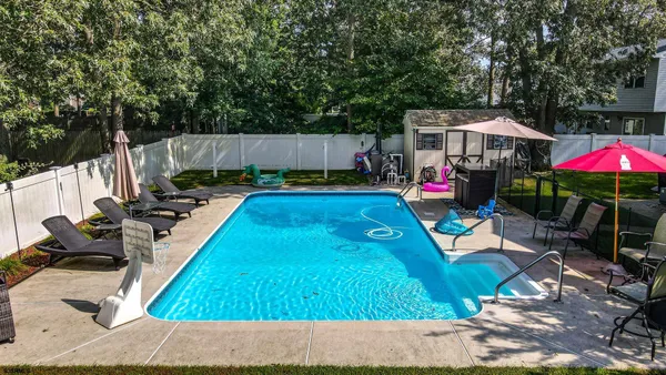 a view of a swimming pool with a patio
