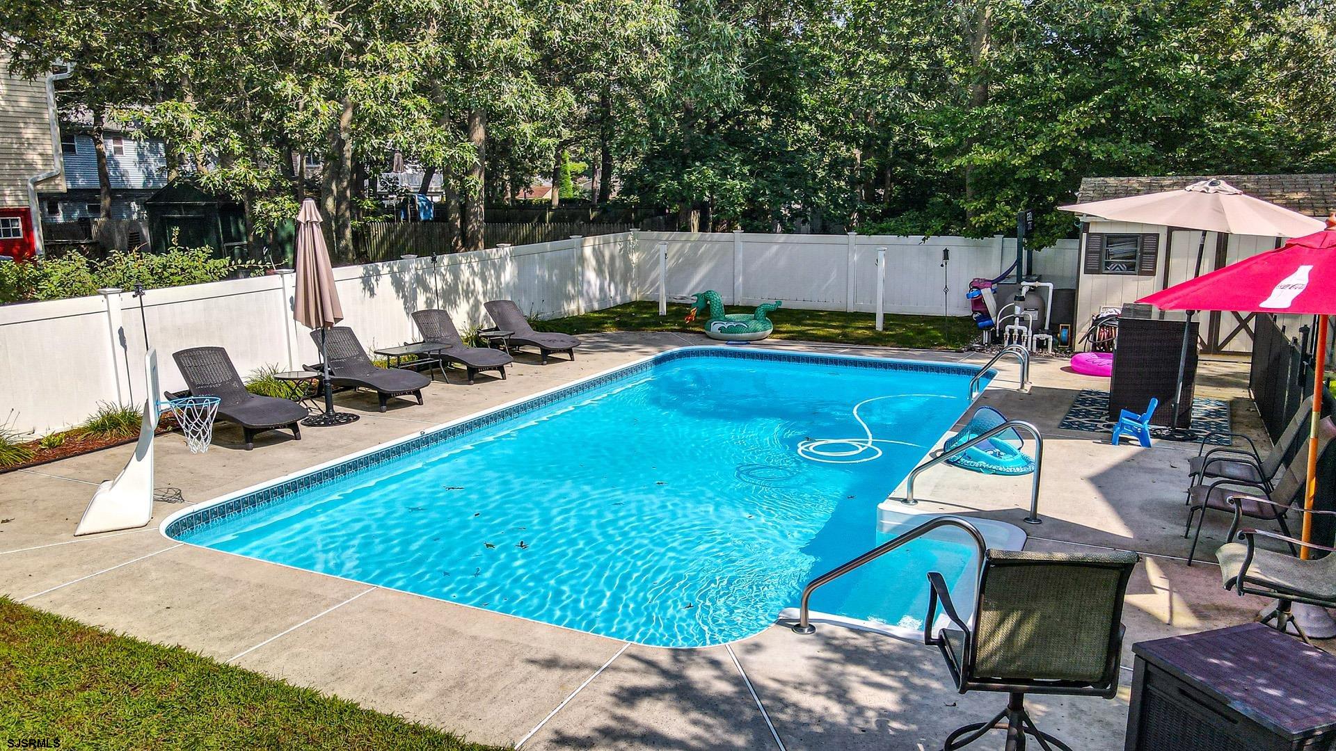 68 Defeo Lane Somers Point, NJ 08244 - Photo 44 of 51 a view of a swimming pool with a patio