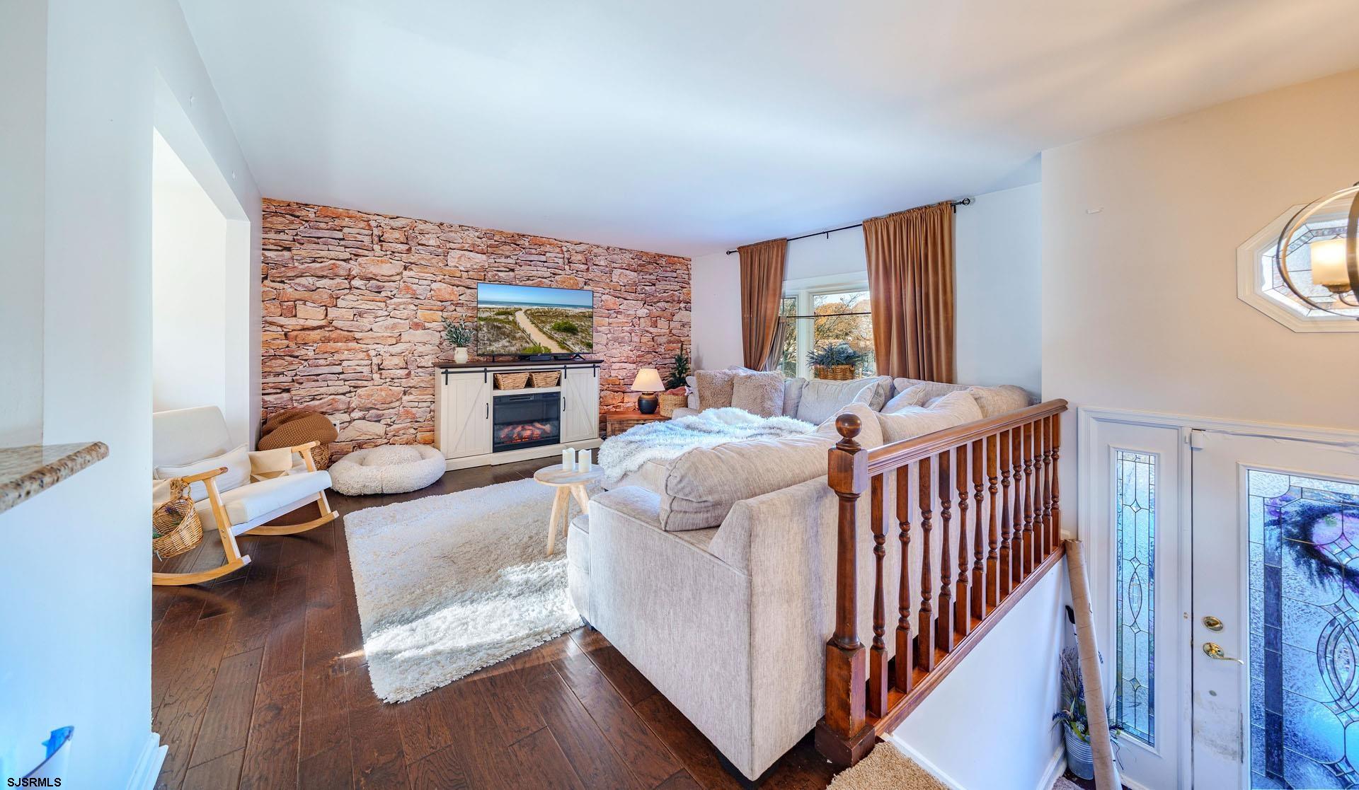 68 Defeo Lane Somers Point, NJ 08244 - Photo 5 of 51 a bed room with furniture and a fireplace