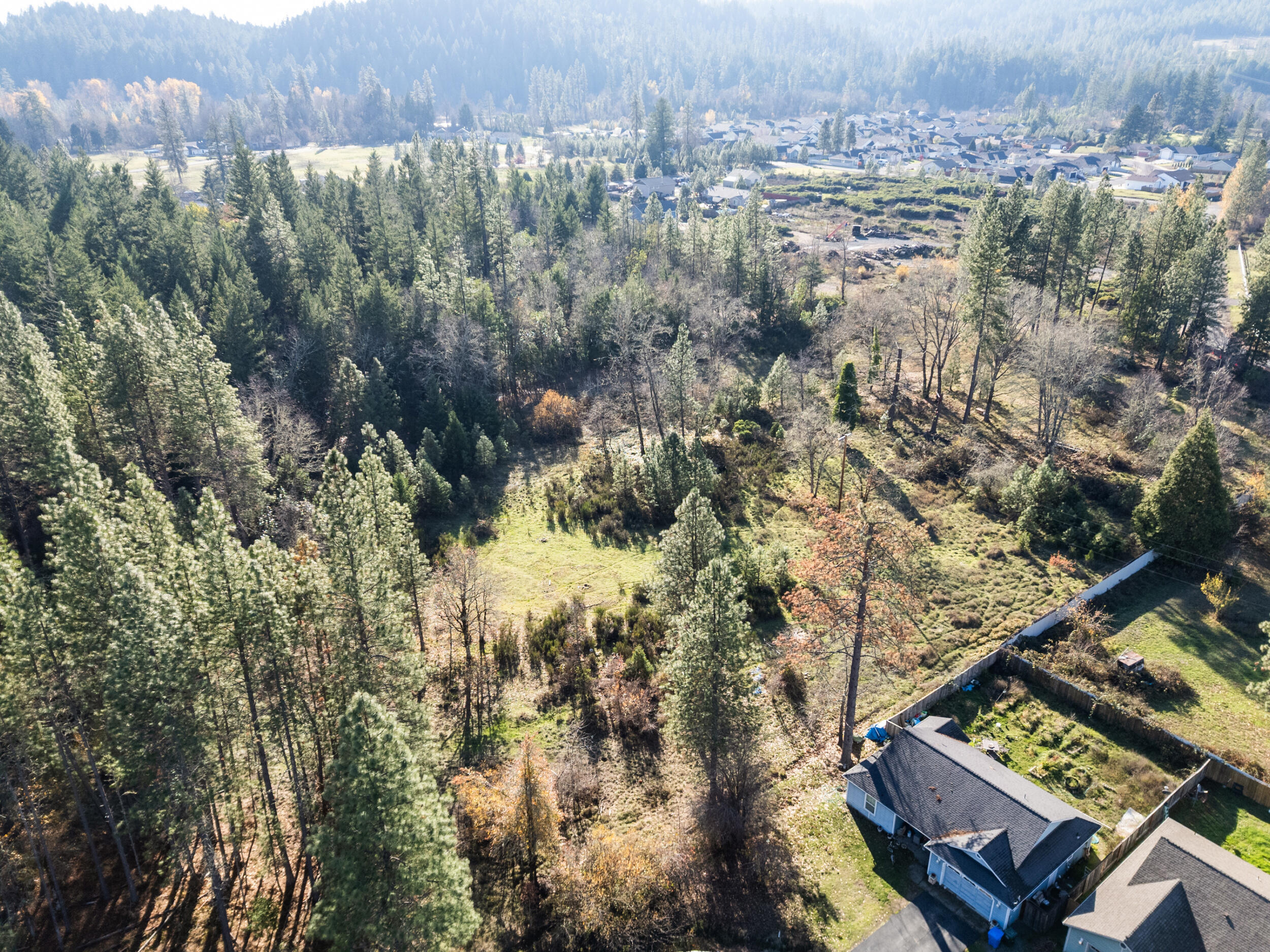 681 Daisy Hill Road Cave Junction, OR 97523 - Photo 13 of 26 a view of a city from a lake