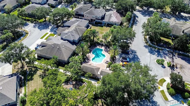 an aerial view of residential house with swimming pool and outdoor space