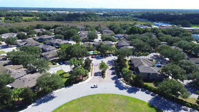 an aerial view of a house with a garden