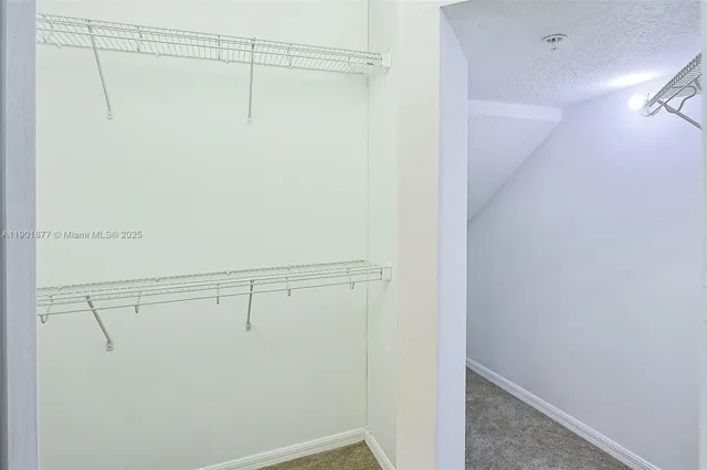 a view of a room with racks on the wall