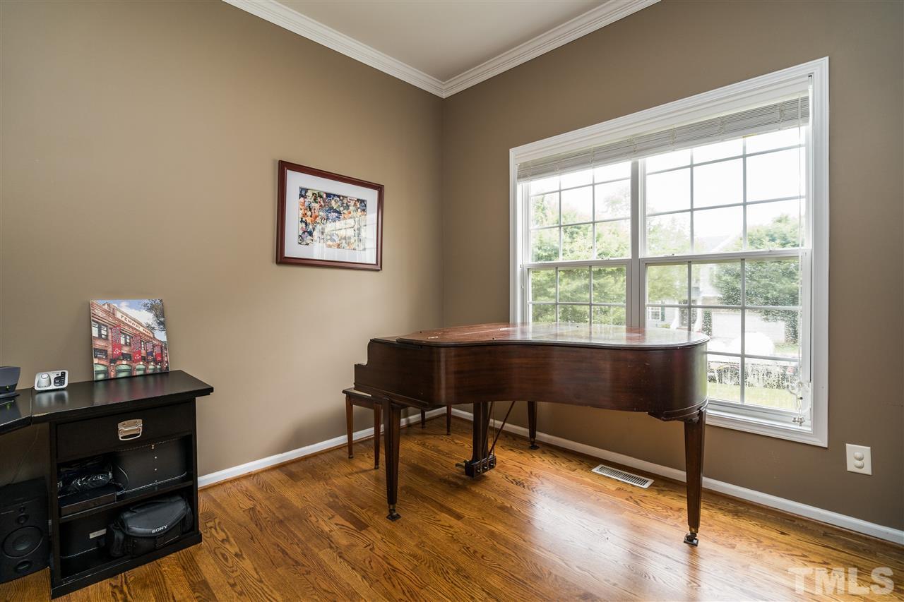 228 Mickleson Ridge Drive Raleigh, NC 27603 - Photo 11 of 25 a living room with furniture and a window