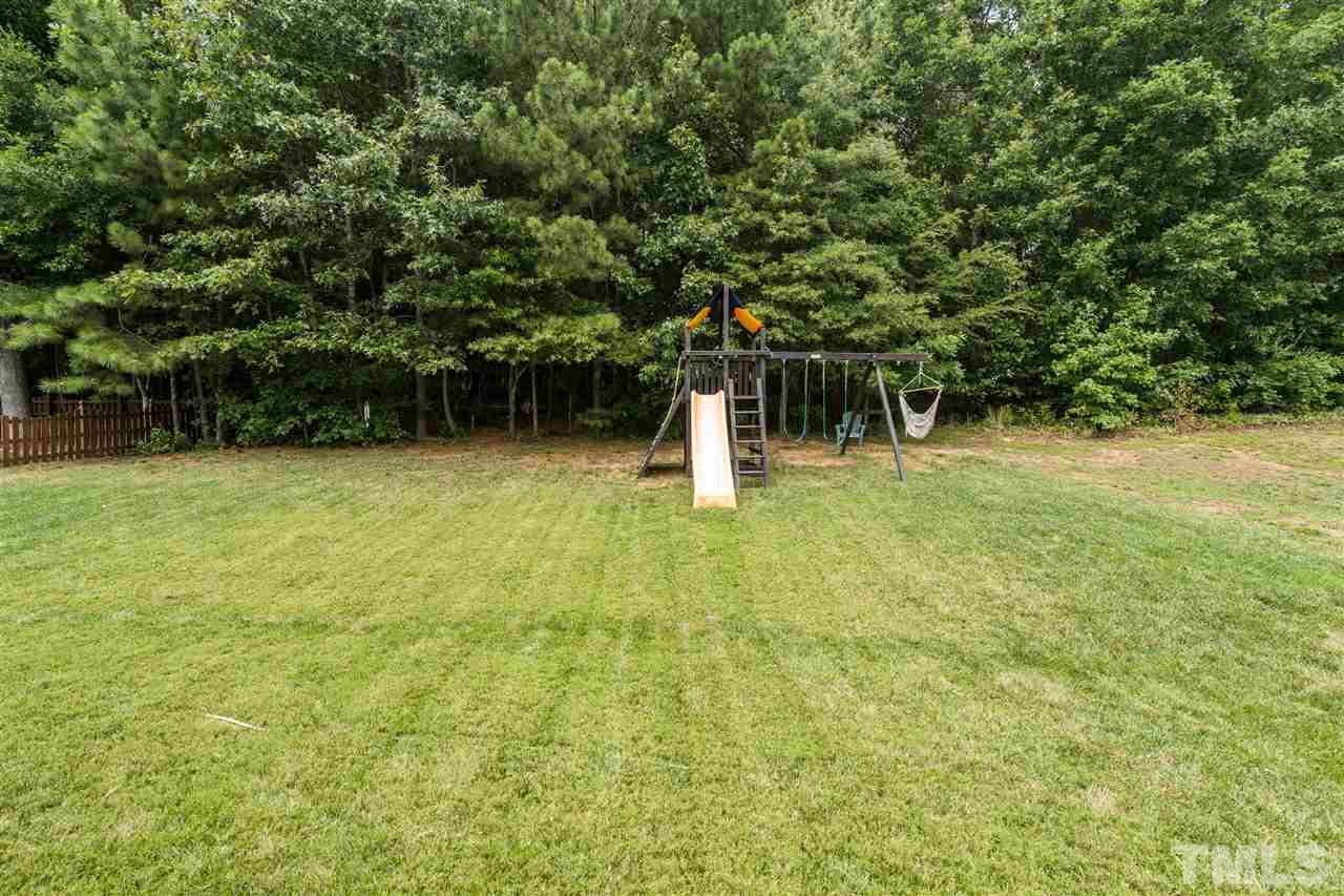 228 Mickleson Ridge Drive Raleigh, NC 27603 - Photo 18 of 25 a fire hydrant in the middle of a field