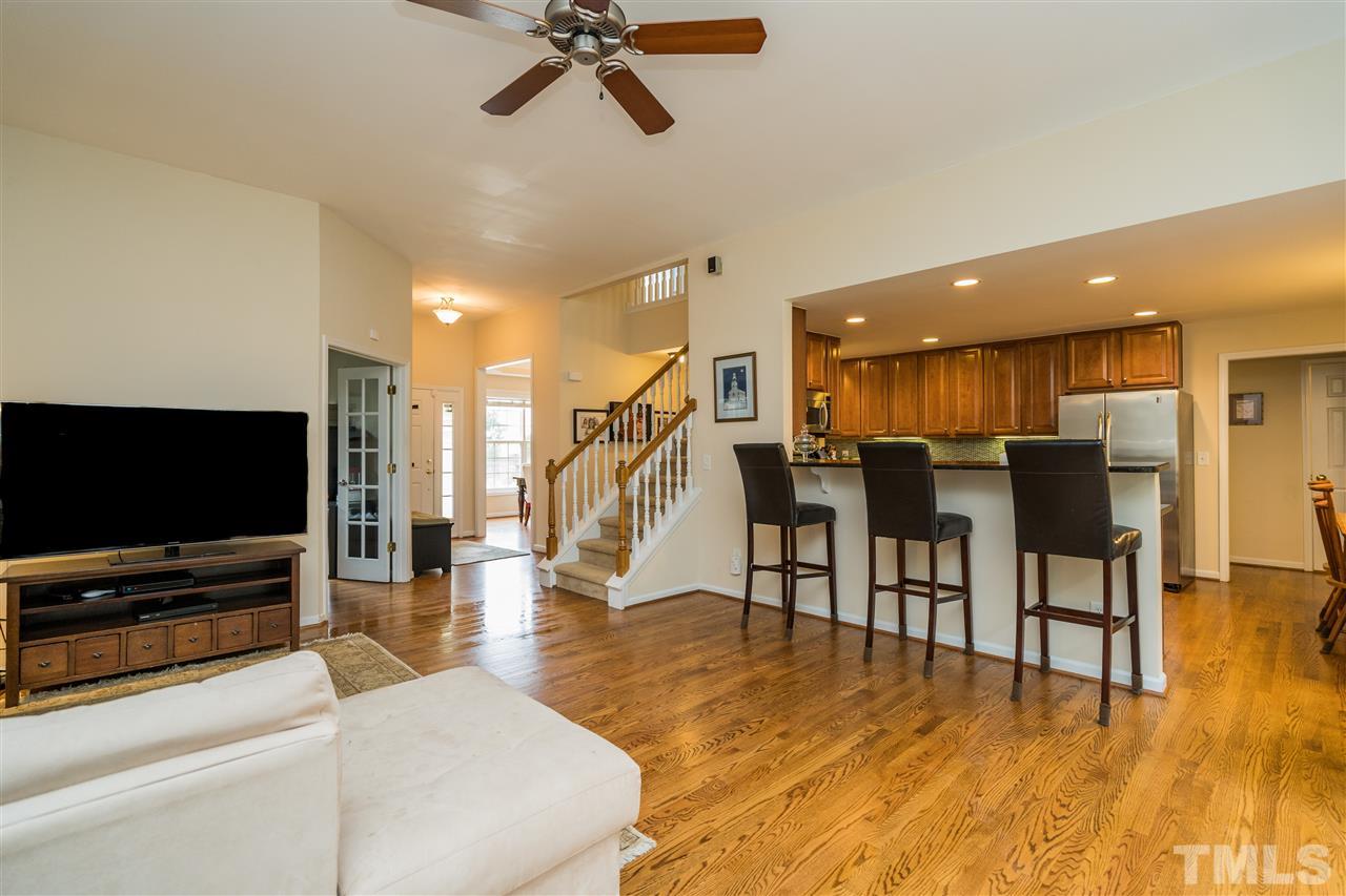 228 Mickleson Ridge Drive Raleigh, NC 27603 - Photo 3 of 25 a living room with furniture and a flat screen tv