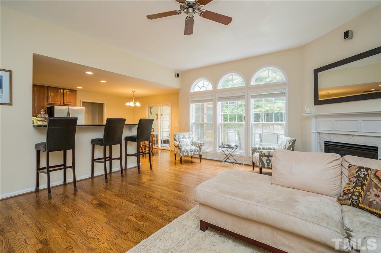 228 Mickleson Ridge Drive Raleigh, NC 27603 - Photo 4 of 25 a living room with furniture and a large window with garden view