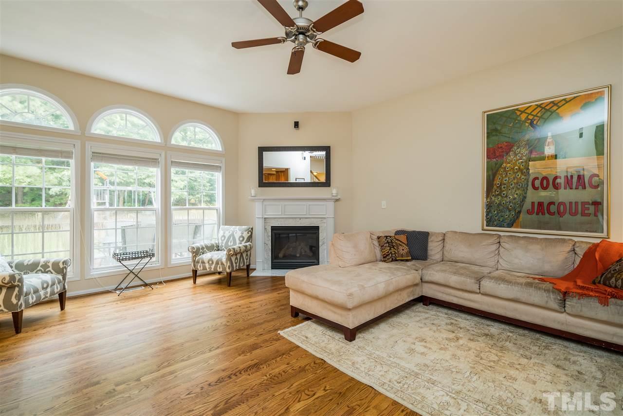 228 Mickleson Ridge Drive Raleigh, NC 27603 - Photo 5 of 25 a living room with furniture and a fireplace