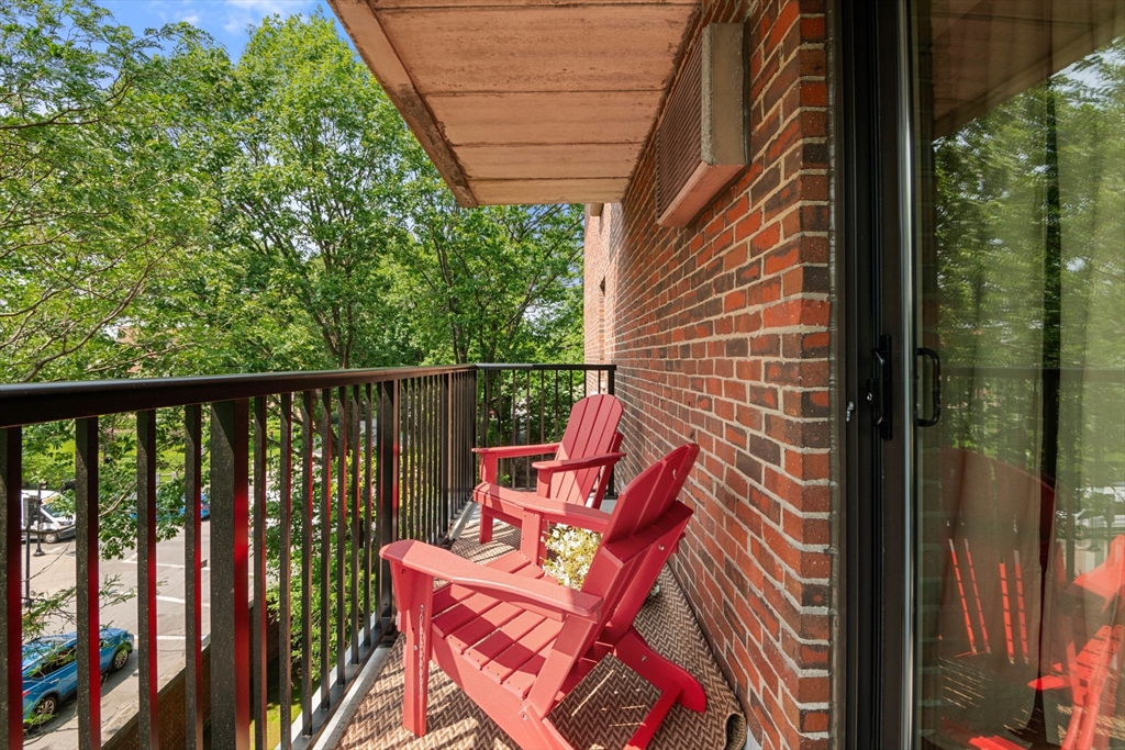 135 Pleasant Street, Unit 403 Brookline, MA 02446 - Photo 13 of 18 a view of a two chairs in the balcony
