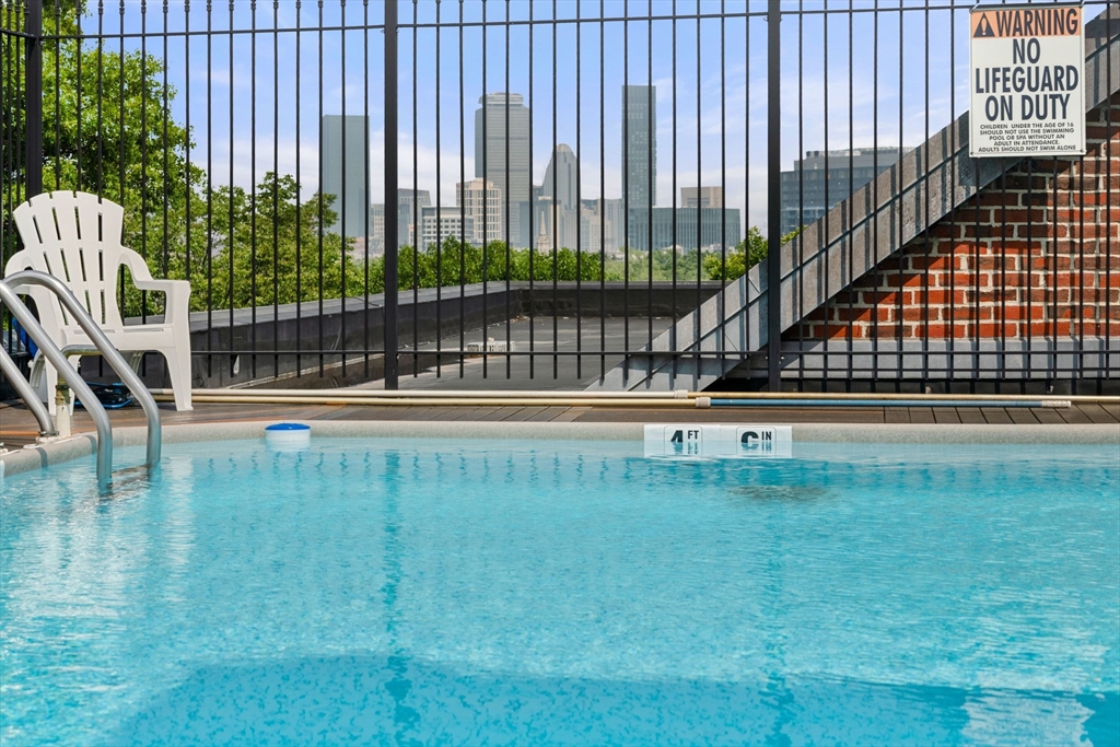 135 Pleasant Street, Unit 403 Brookline, MA 02446 - Photo 16 of 18 a view of swimming pool with outdoor seating