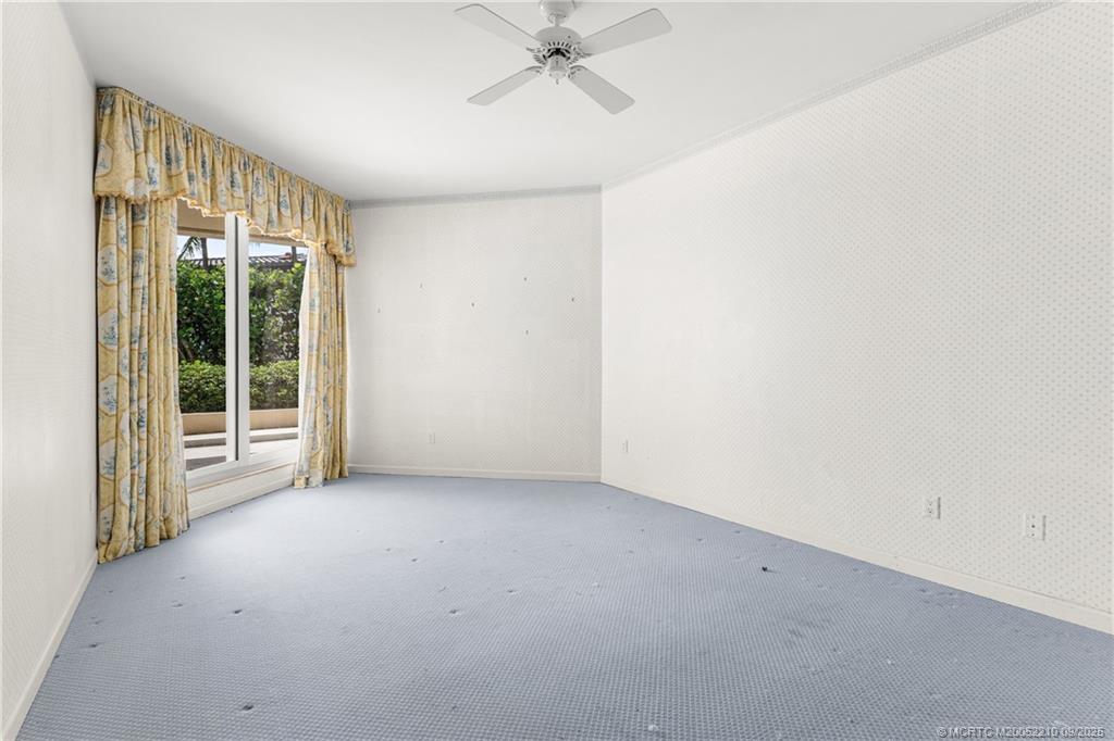 3001 Southeast Island Point Lane, Unit 14 Stuart, FL 34996 - Photo 13 of 38 an empty room with a window