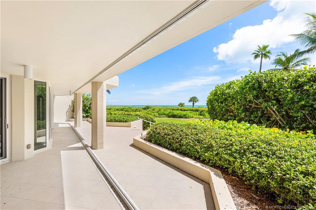 3001 Southeast Island Point Lane, Unit 14 Stuart, FL 34996 - Photo 21 of 38 a balcony with view of an outdoor space
