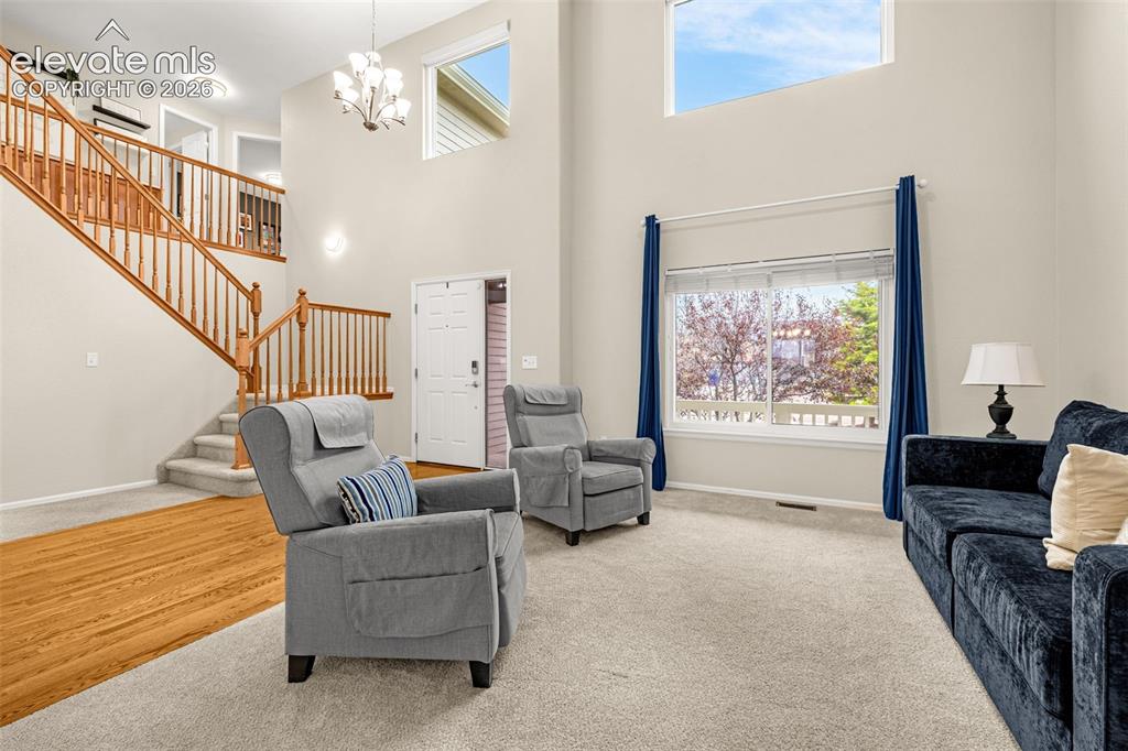 9127 Oakmont Road Peyton, CO 80831 - Photo 5 of 49 a living room with furniture and a large window