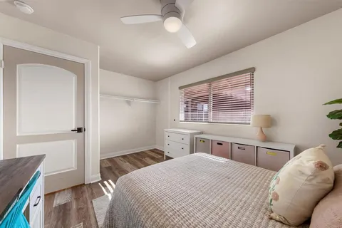 a bedroom with a bed and a window