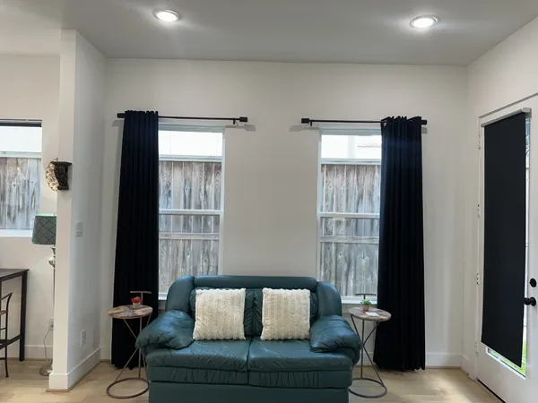 a bedroom with a bed and a mirror