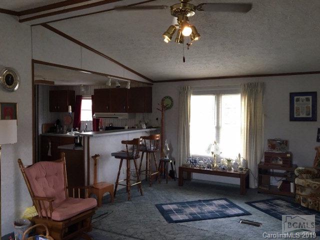 2281 Byrd Road Morganton, NC 28655 - Photo 5 of 12 a view of a dining room with furniture window and wooden floor