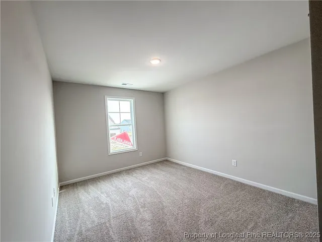 an empty room with window and window