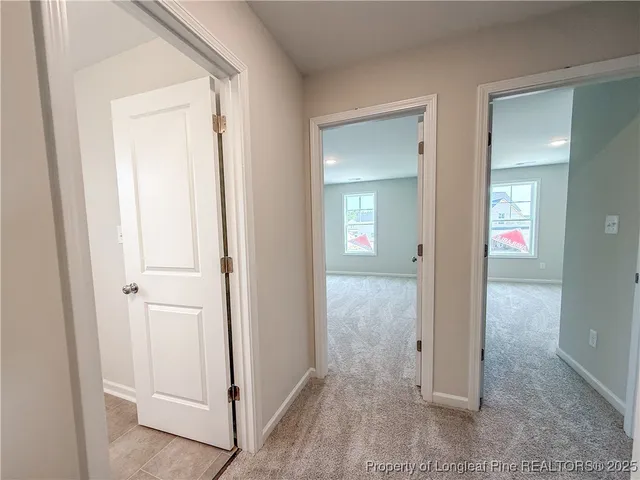 wooden view of a livingroom from a hallway
