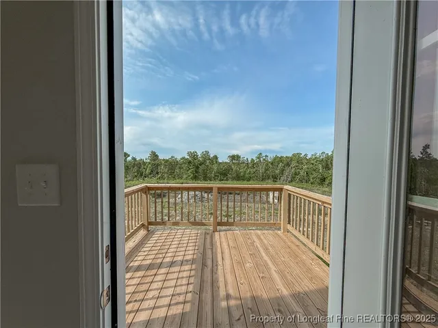 a view of balcony with wooden floor