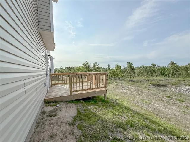 a view of a roof deck with wooden fence
