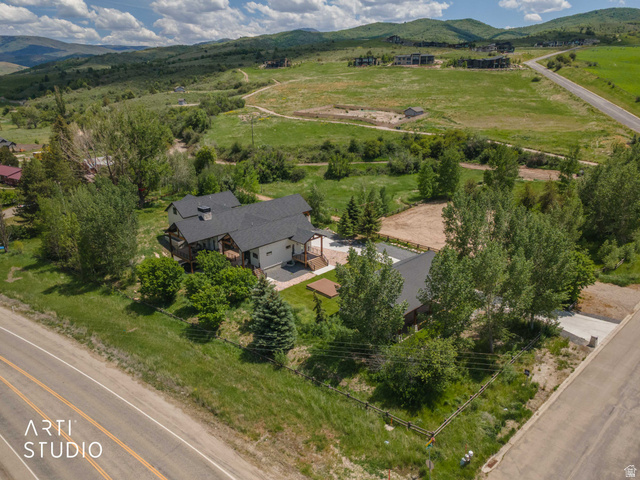 1188 South Old Trappers Loop Road Huntsville, UT 84317 - Photo 82 of 92 Modern residence with a dark shingle roof, light-colored siding, and a prominent attached garage