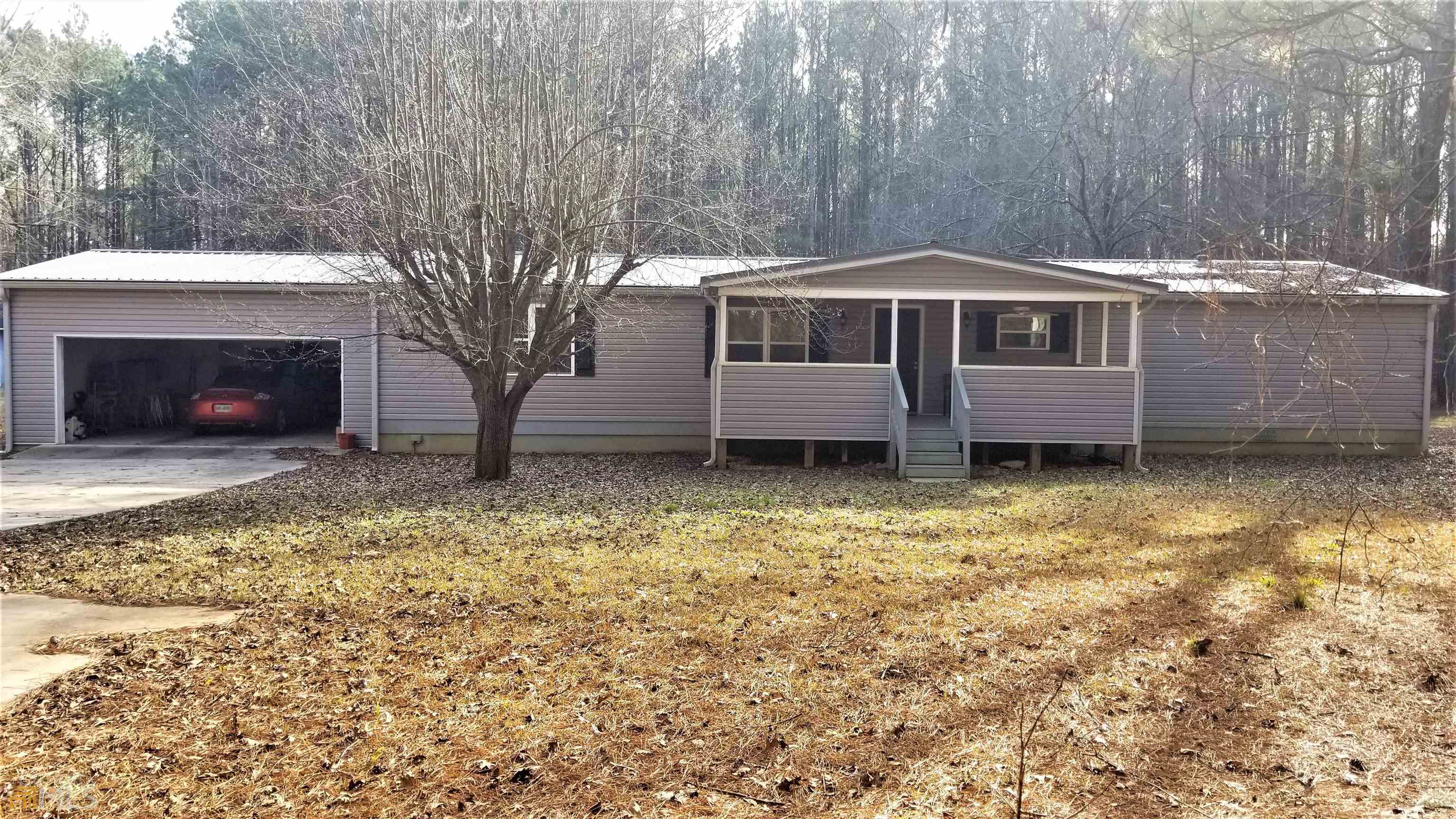 295 Crane Road Zebulon, GA 30295 - Photo 1 of 1 a front view of a house with a yard