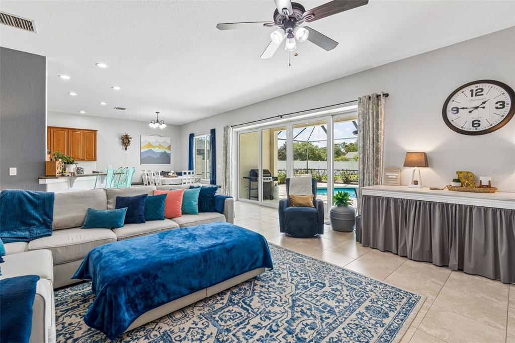 11830 Newberry Grove Loop Riverview, FL 33579 - Photo 11 of 58 a living room with furniture a rug and a large window