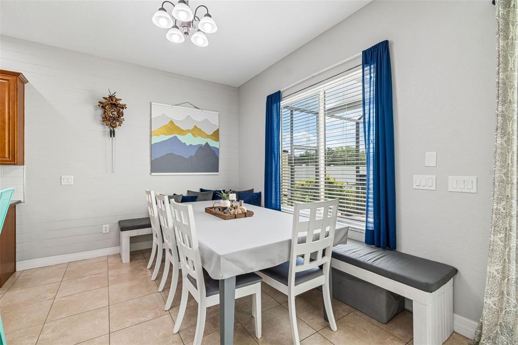 11830 Newberry Grove Loop Riverview, FL 33579 - Photo 14 of 58 a view of a dining room with furniture and window