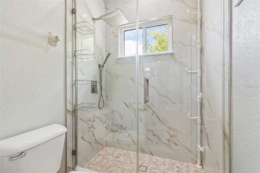 11830 Newberry Grove Loop Riverview, FL 33579 - Photo 27 of 58 a bathroom with a shower and toilet
