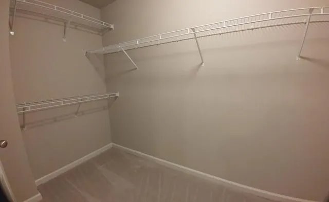 a view of a room with racks on the wall