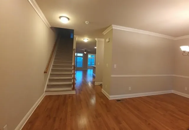 a view of entryway with wooden floor