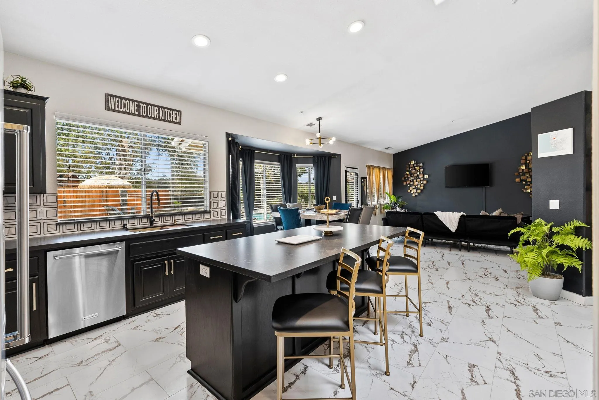 624 Rowley Way Ramona, CA 92065 - Photo 13 of 54 a living room with stainless steel appliances kitchen island granite countertop a table chairs sink and cabinets