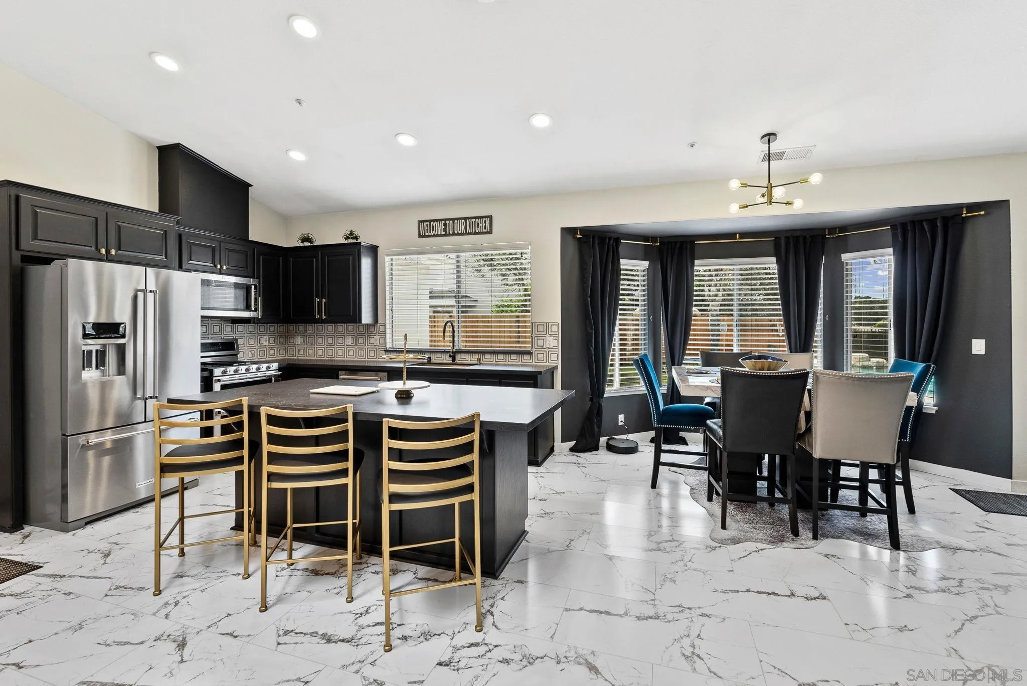 624 Rowley Way Ramona, CA 92065 - Photo 14 of 54 a large kitchen with a table and chairs