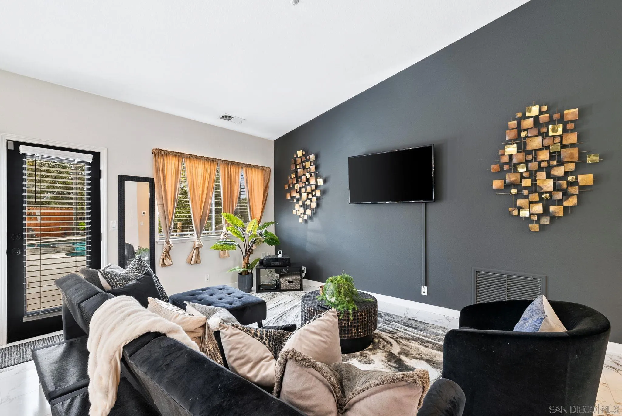 624 Rowley Way Ramona, CA 92065 - Photo 20 of 54 a living room with furniture a flat screen tv and a large window