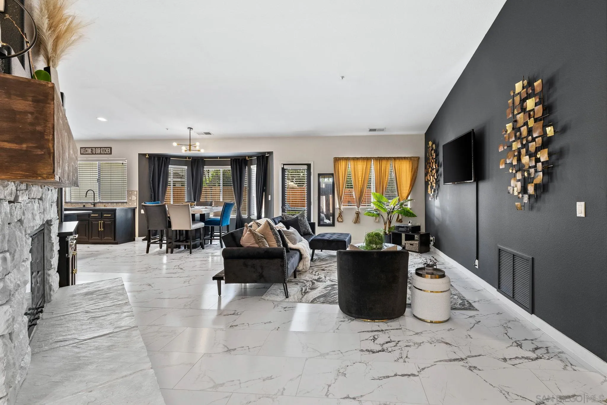 624 Rowley Way Ramona, CA 92065 - Photo 23 of 54 a living room with furniture a chandelier and a view of kitchen