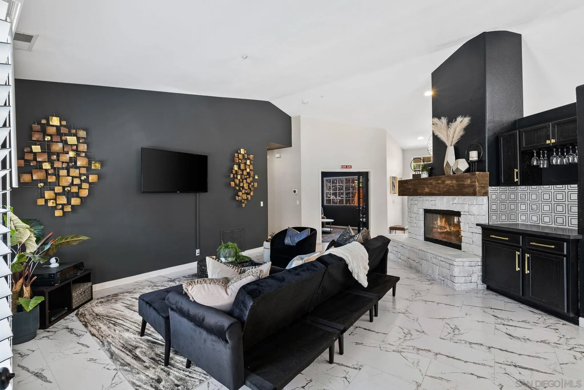 624 Rowley Way Ramona, CA 92065 - Photo 24 of 54 a living room with furniture a flat screen tv and a fireplace