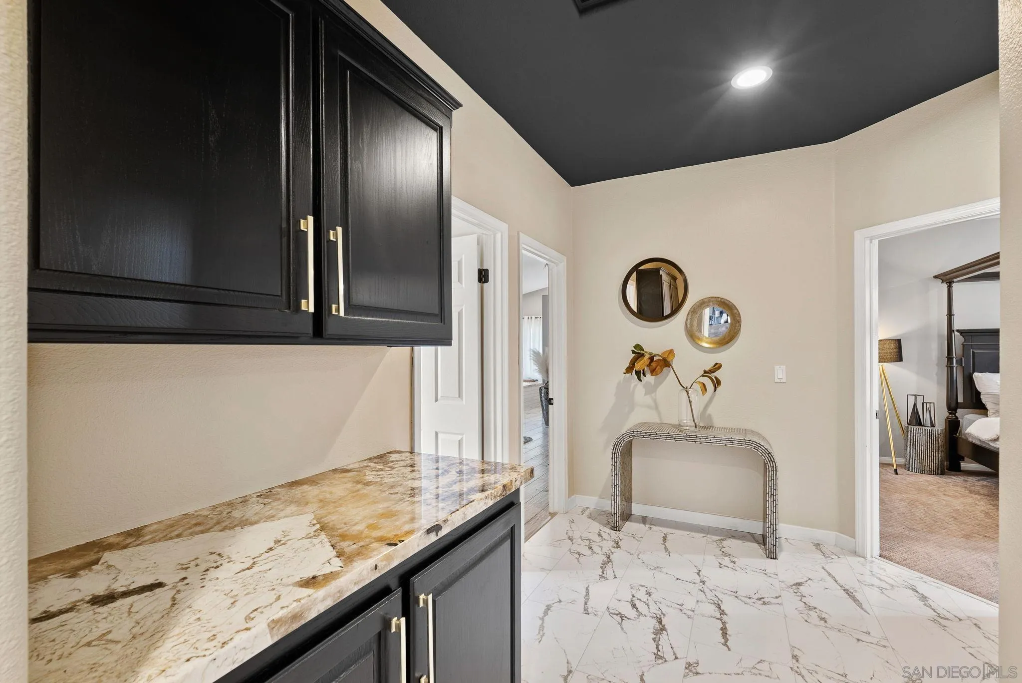 624 Rowley Way Ramona, CA 92065 - Photo 27 of 54 a bathroom with a granite countertop sink a mirror and shower