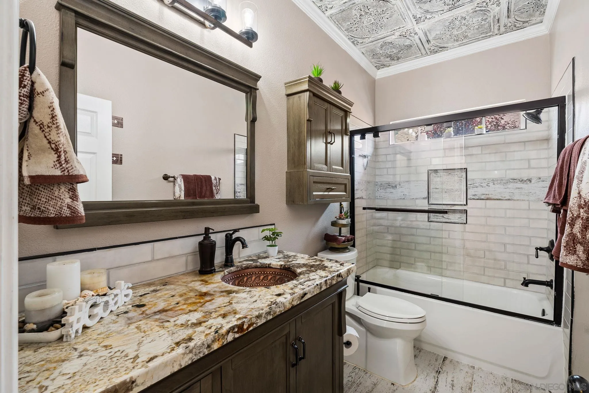 624 Rowley Way Ramona, CA 92065 - Photo 29 of 54 a bathroom with a granite countertop sink toilet and shower
