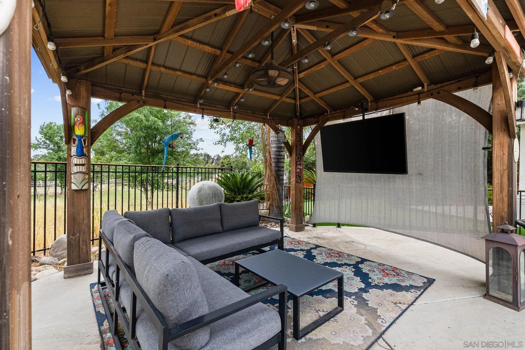 624 Rowley Way Ramona, CA 92065 - Photo 40 of 54 a outdoor living space with furniture and a black umbrella