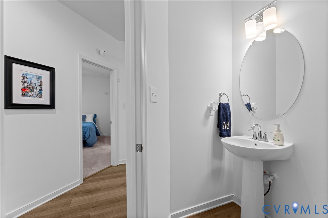 8819 Roberta Road Mechanicsville, VA 23116 - Photo 22 of 79 Pedestal sink with chrome faucet, circular mirror,