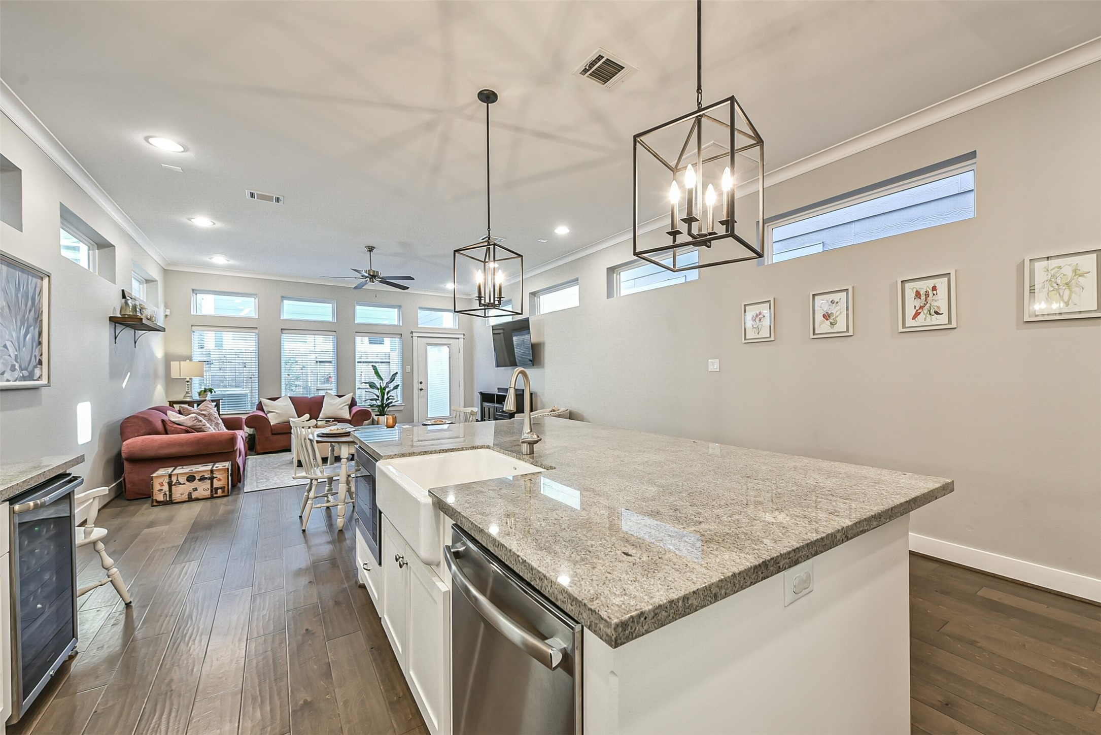 3222 Gillespie Street Houston, TX 77020 - Photo 23 of 43 a kitchen with stainless steel appliances granite countertop granite countertop a sink dishwasher and a dining table with wooden floor
