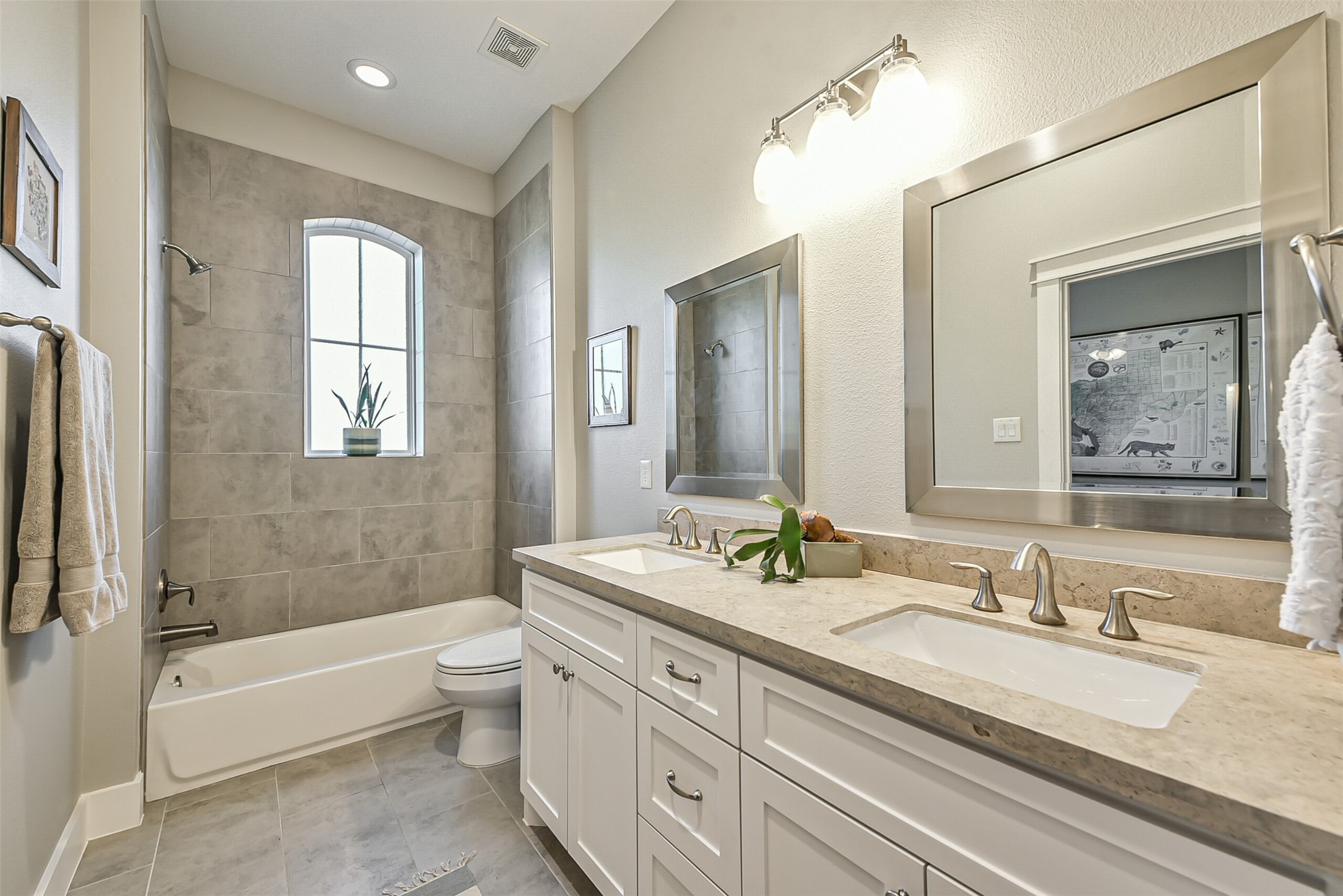 3222 Gillespie Street Houston, TX 77020 - Photo 31 of 43 a bathroom with a granite countertop tub a double vanity sink and a large mirror